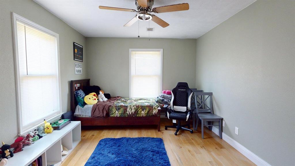 1766 Boss Range Road Justin, TX 76247 - Photo 29 of 35 a bedroom with bed and a window