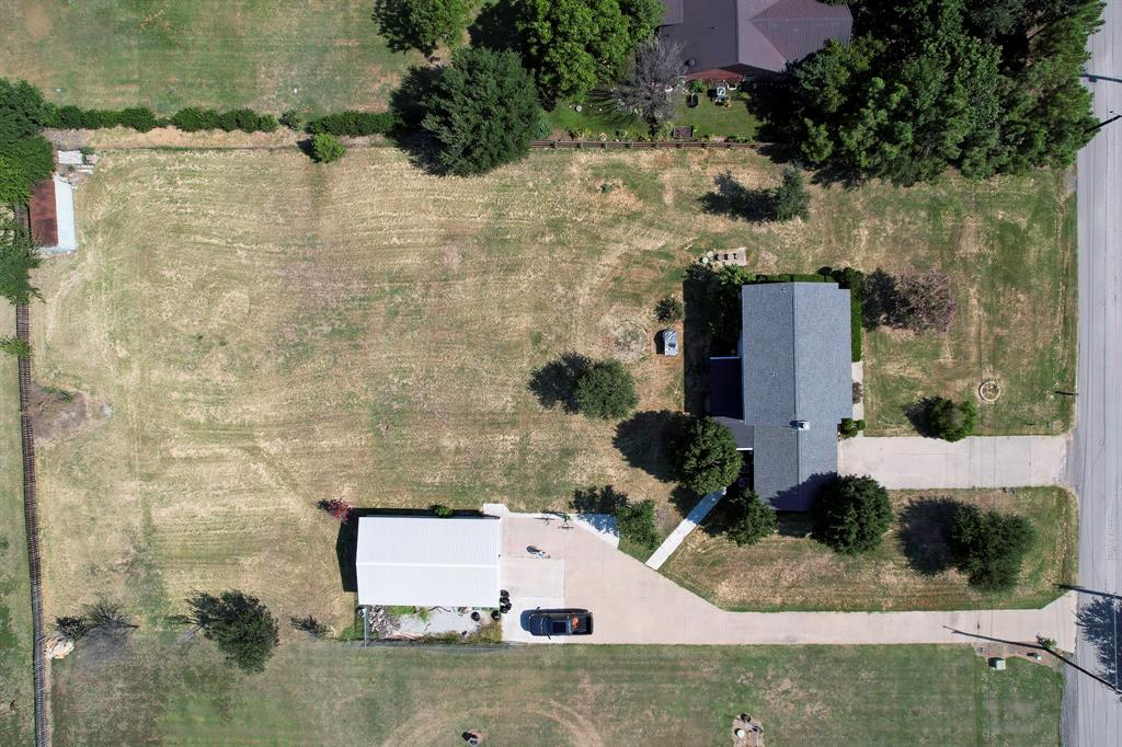 1766 Boss Range Road Justin, TX 76247 - Photo 33 of 35 an aerial view of a house with a yard