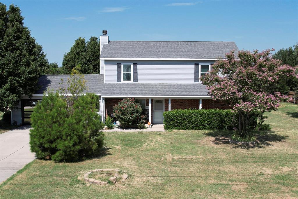 1766 Boss Range Road Justin, TX 76247 - Photo 6 of 35 a front view of a house with a yard
