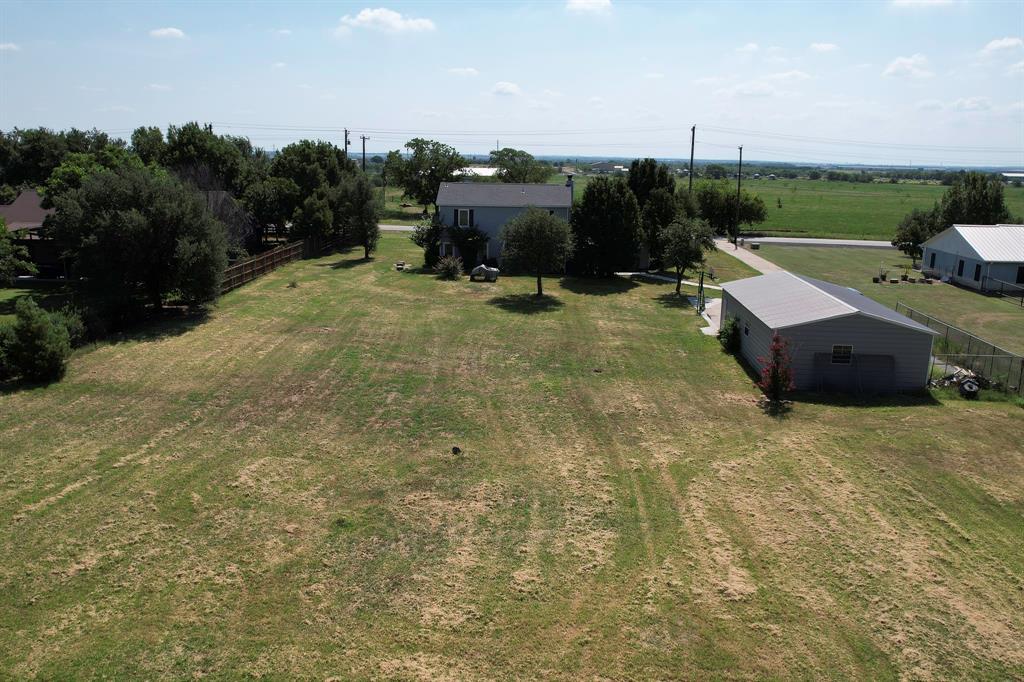 1766 Boss Range Road Justin, TX 76247 - Photo 9 of 35 a view of a terrace with a yard