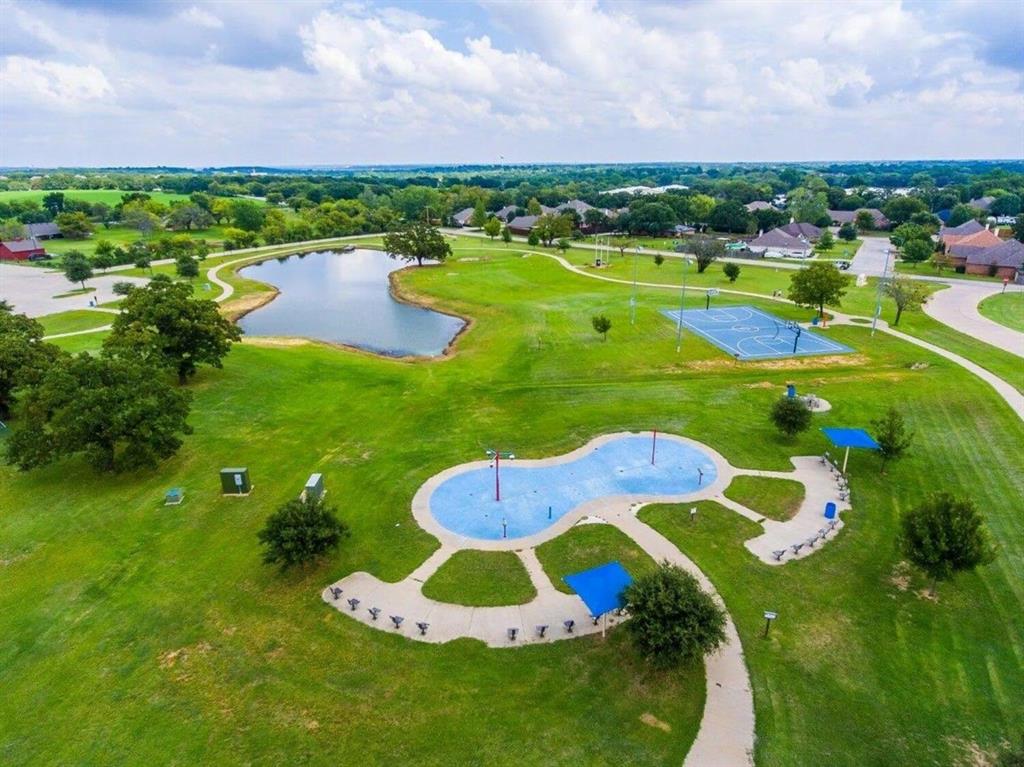 27 Old Crow Road Joshua, TX 76058 - Photo 4 of 6 a swimming pool with outdoor seating and yard