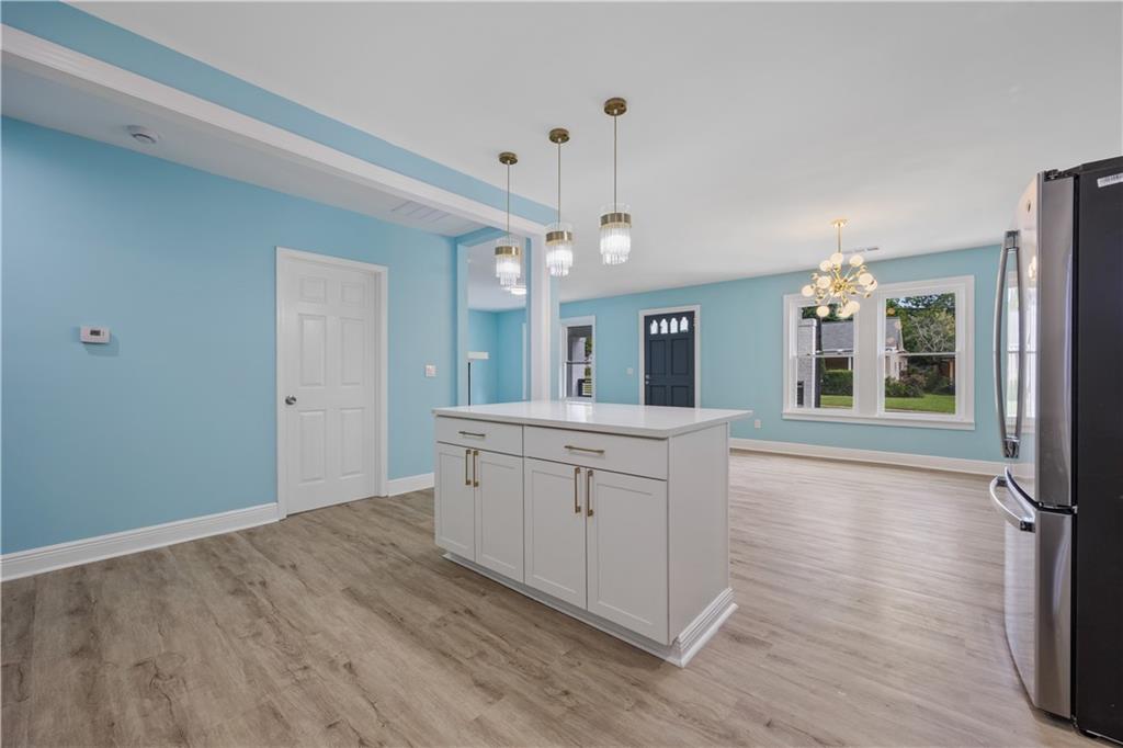 1658 Temple Avenue Atlanta, GA 30337 - Photo 12 of 27 a spacious bathroom with a granite countertop sink mirror and a shower