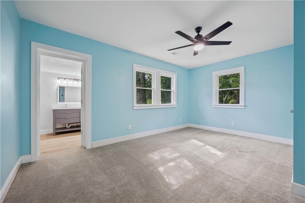 1658 Temple Avenue Atlanta, GA 30337 - Photo 18 of 27 a view of a livingroom with a ceiling fan and window