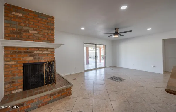 a view of an empty room with a fireplace