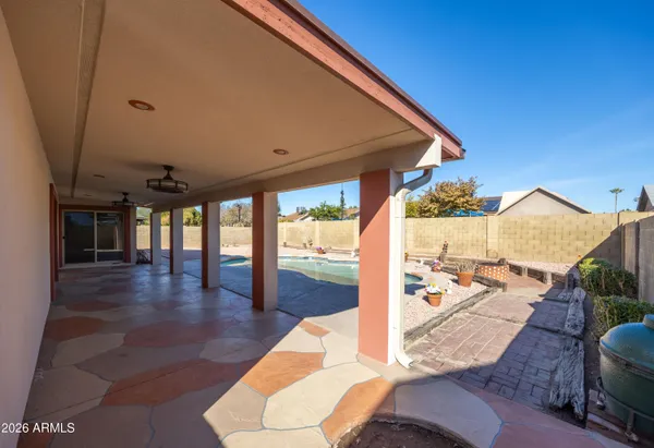 a view of a living room and balcony