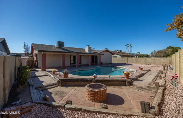 a couple of cars parked in front of a house