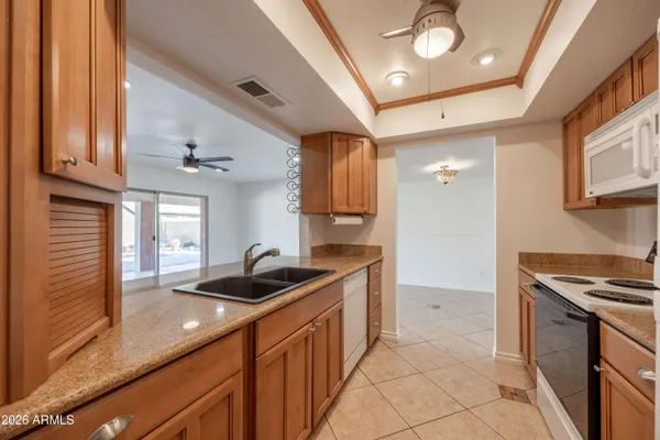 a kitchen that has a sink and a stove