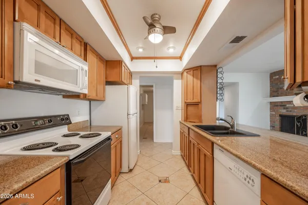 a kitchen that has a sink and a stove