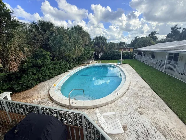 a view of a swimming pool with a patio