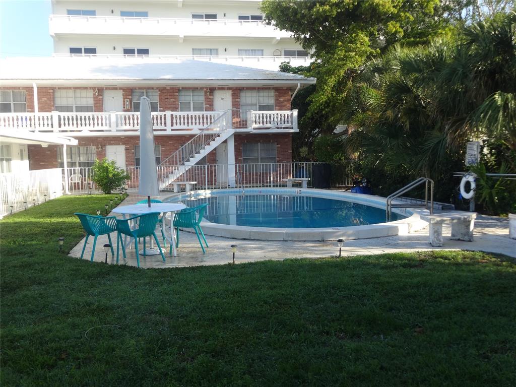 3217 Northeast 11th Street, Unit 7 Pompano Beach, FL 33062 - Photo 3 of 10 a view of a house with a yard deck and sitting area