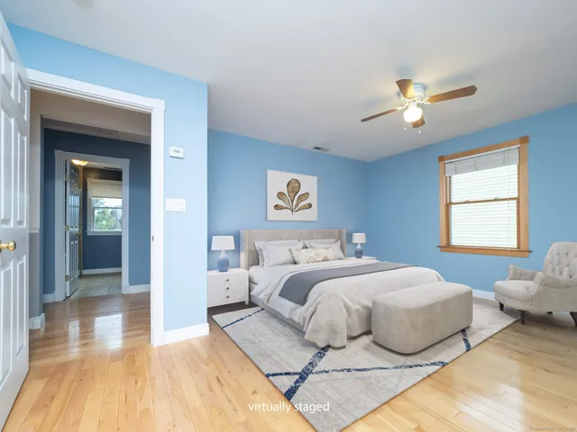 a bedroom with a bed and window