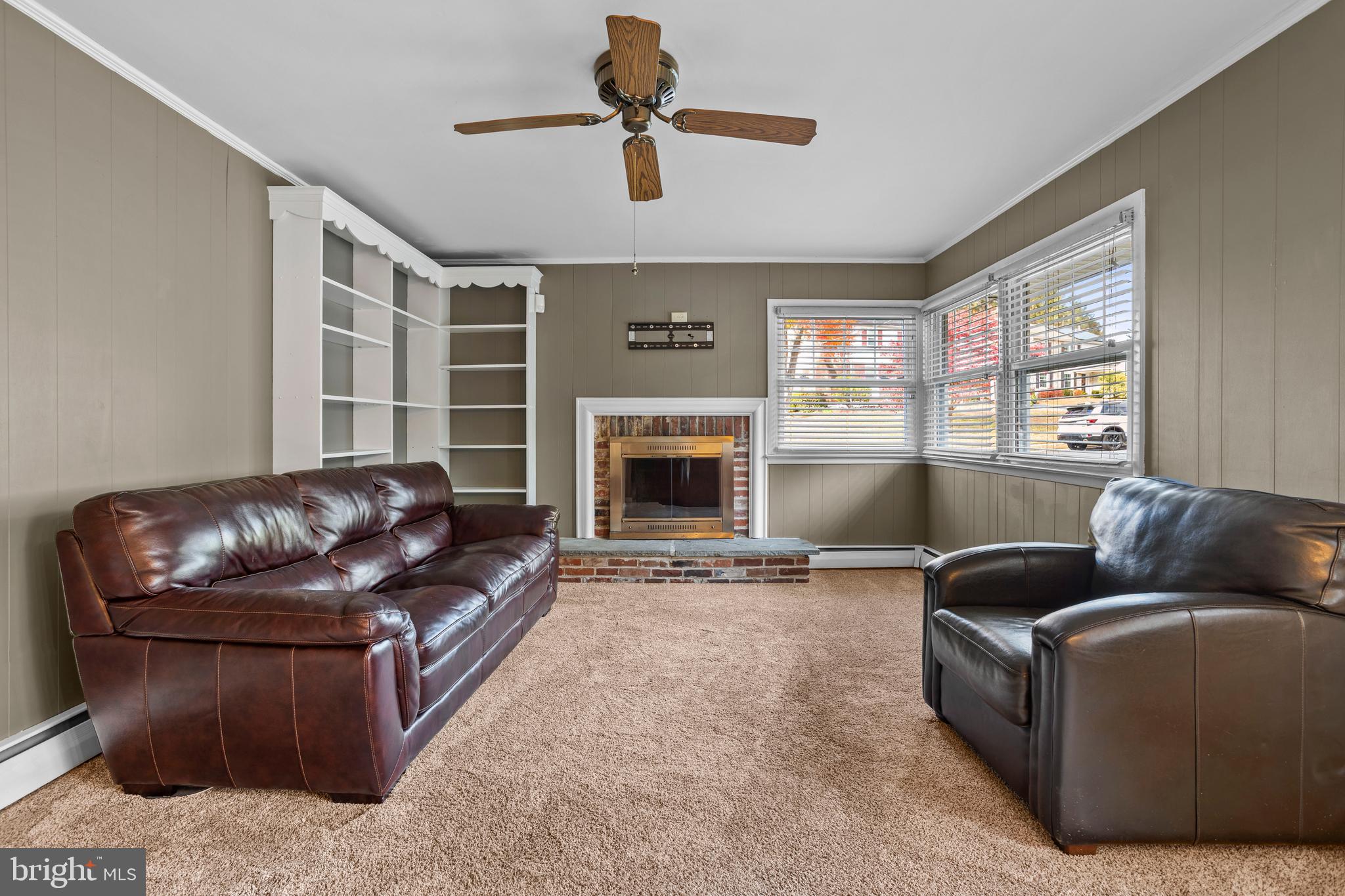 504 Minshall Road Springfield, PA 19064 - Photo 14 of 39 a living room with furniture and a fireplace
