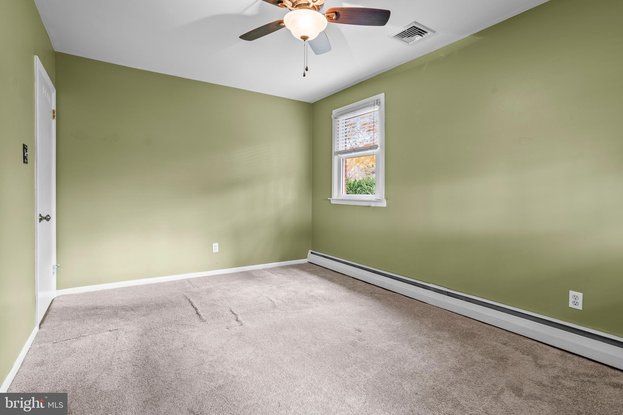 504 Minshall Road Springfield, PA 19064 - Photo 23 of 39 an empty room with a window and a chandelier fan