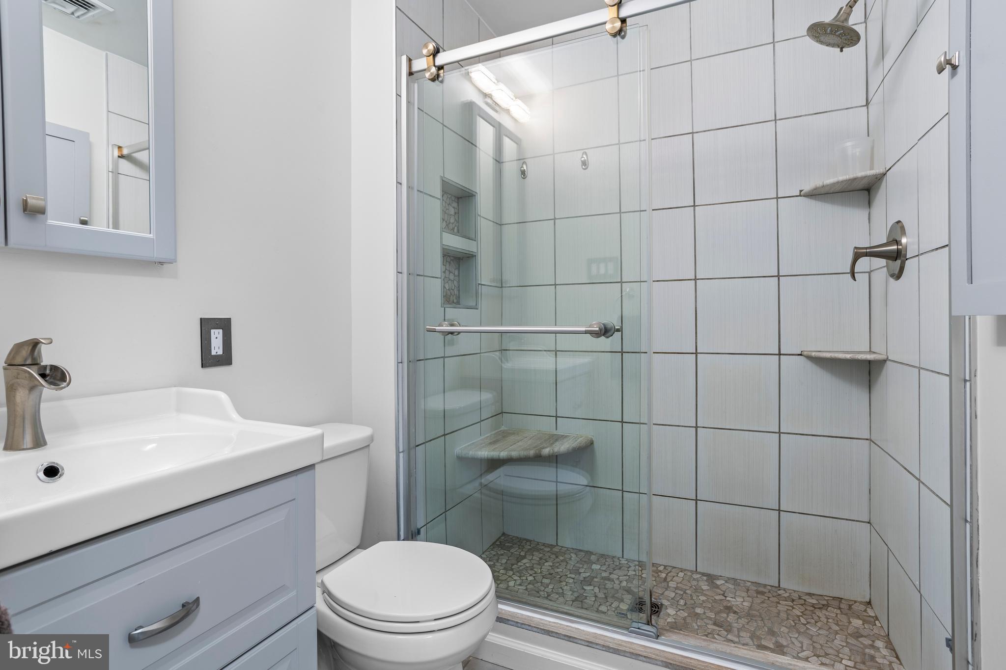 504 Minshall Road Springfield, PA 19064 - Photo 24 of 39 a bathroom with a sink toilet and shower