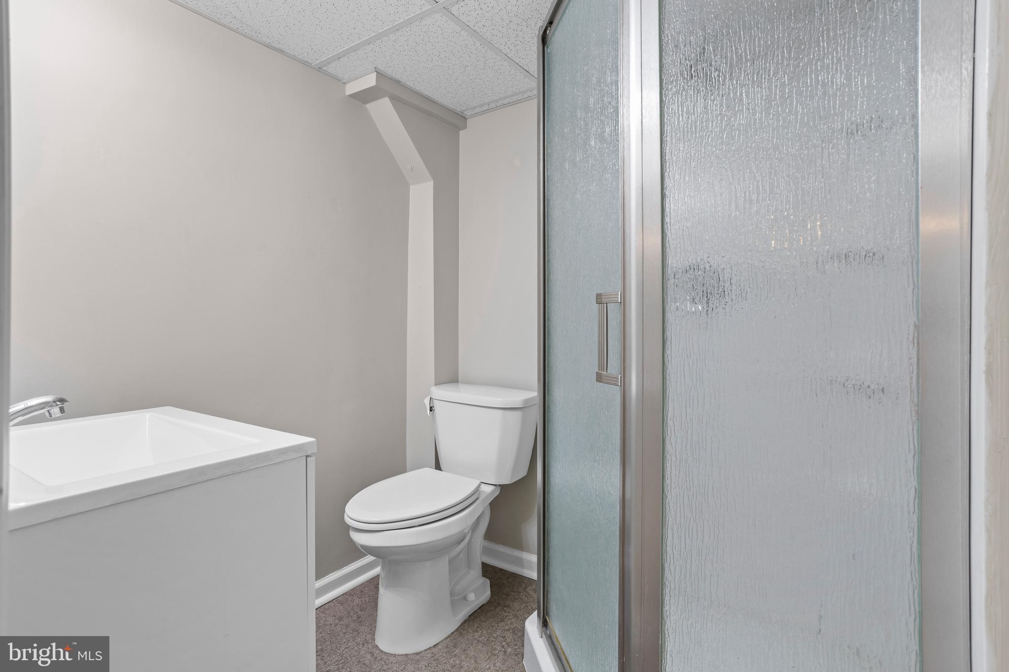 504 Minshall Road Springfield, PA 19064 - Photo 29 of 39 a white toilet sitting next to a bathroom sink