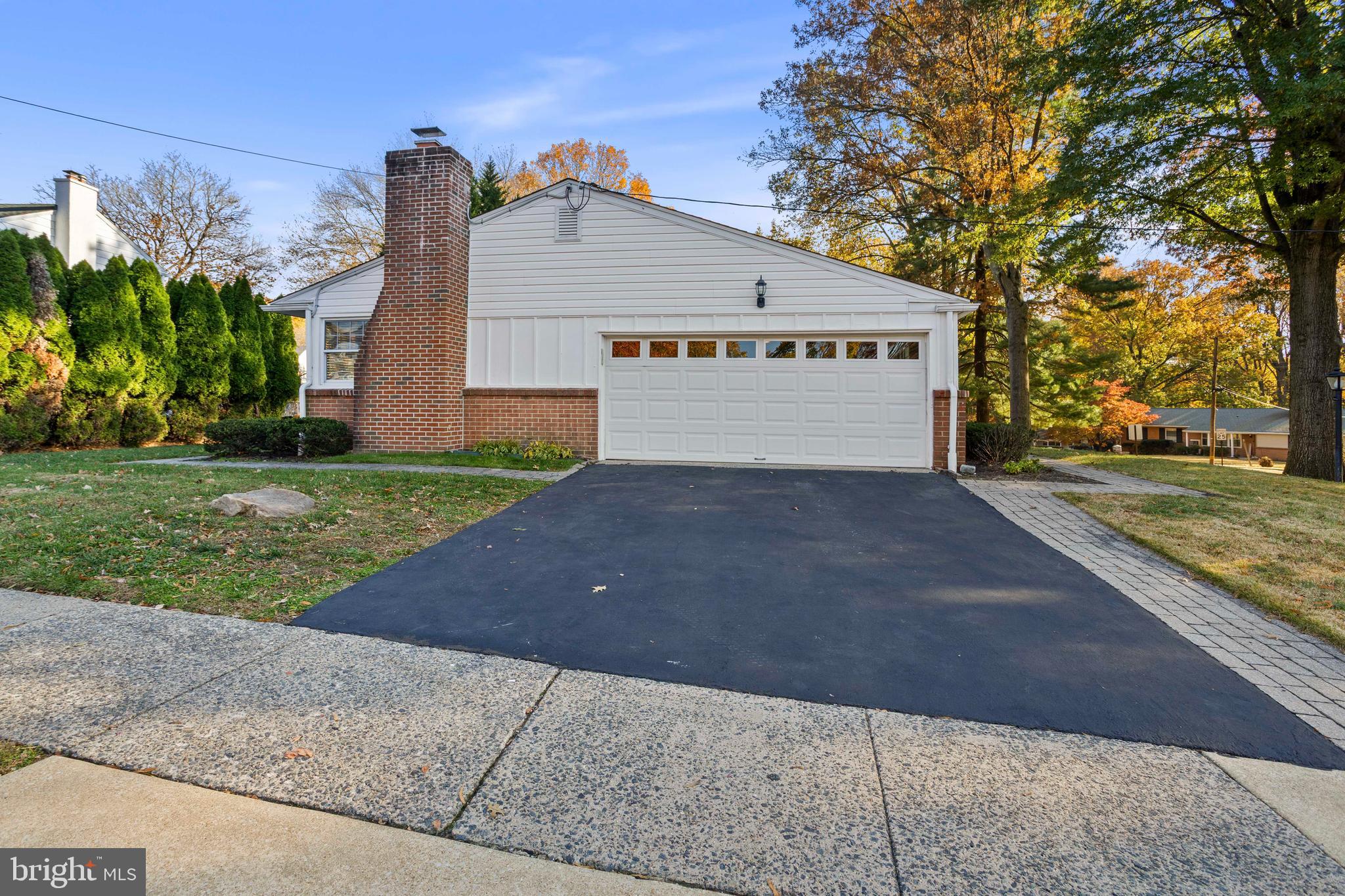 504 Minshall Road Springfield, PA 19064 - Photo 34 of 39 a view of a house with a yard and a garage