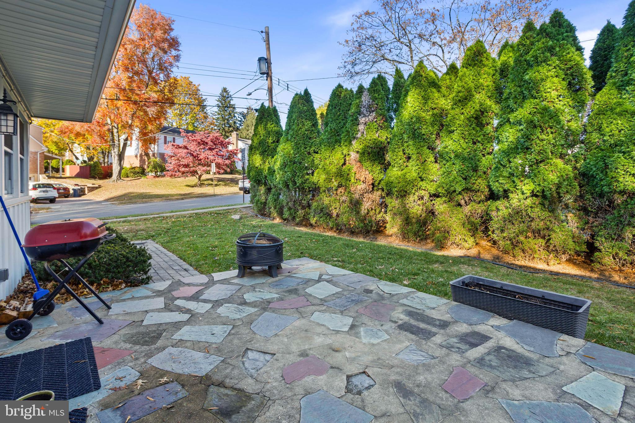 504 Minshall Road Springfield, PA 19064 - Photo 36 of 39 a view of backyard with a table and chairs and potted plants