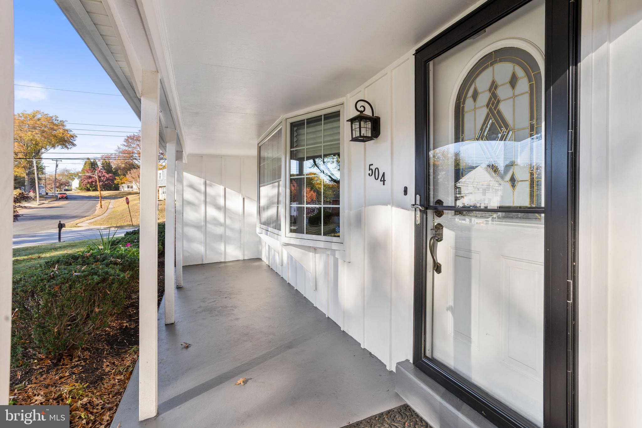 504 Minshall Road Springfield, PA 19064 - Photo 4 of 39 a view of a hallway with wooden floor and a living room