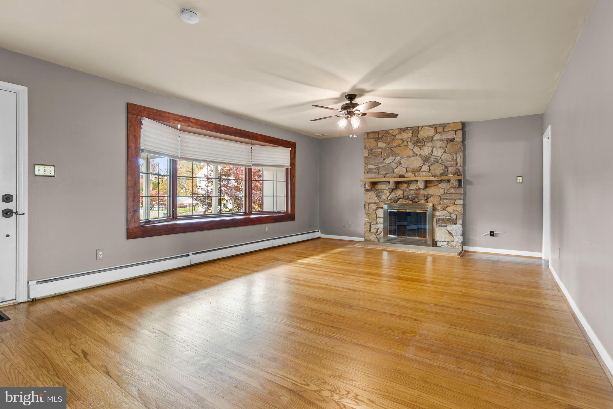 504 Minshall Road Springfield, PA 19064 - Photo 6 of 39 wooden floor in an empty room with a window