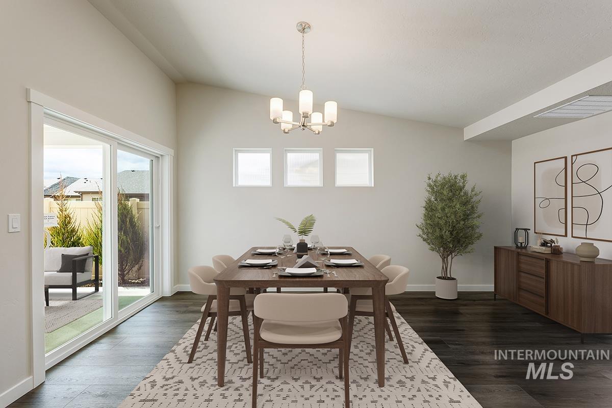 7080 South Gamely Avenue Meridian, ID 83642 - Photo 4 of 30 Dining room featuring suspended lighting and dark wood-style flooring
