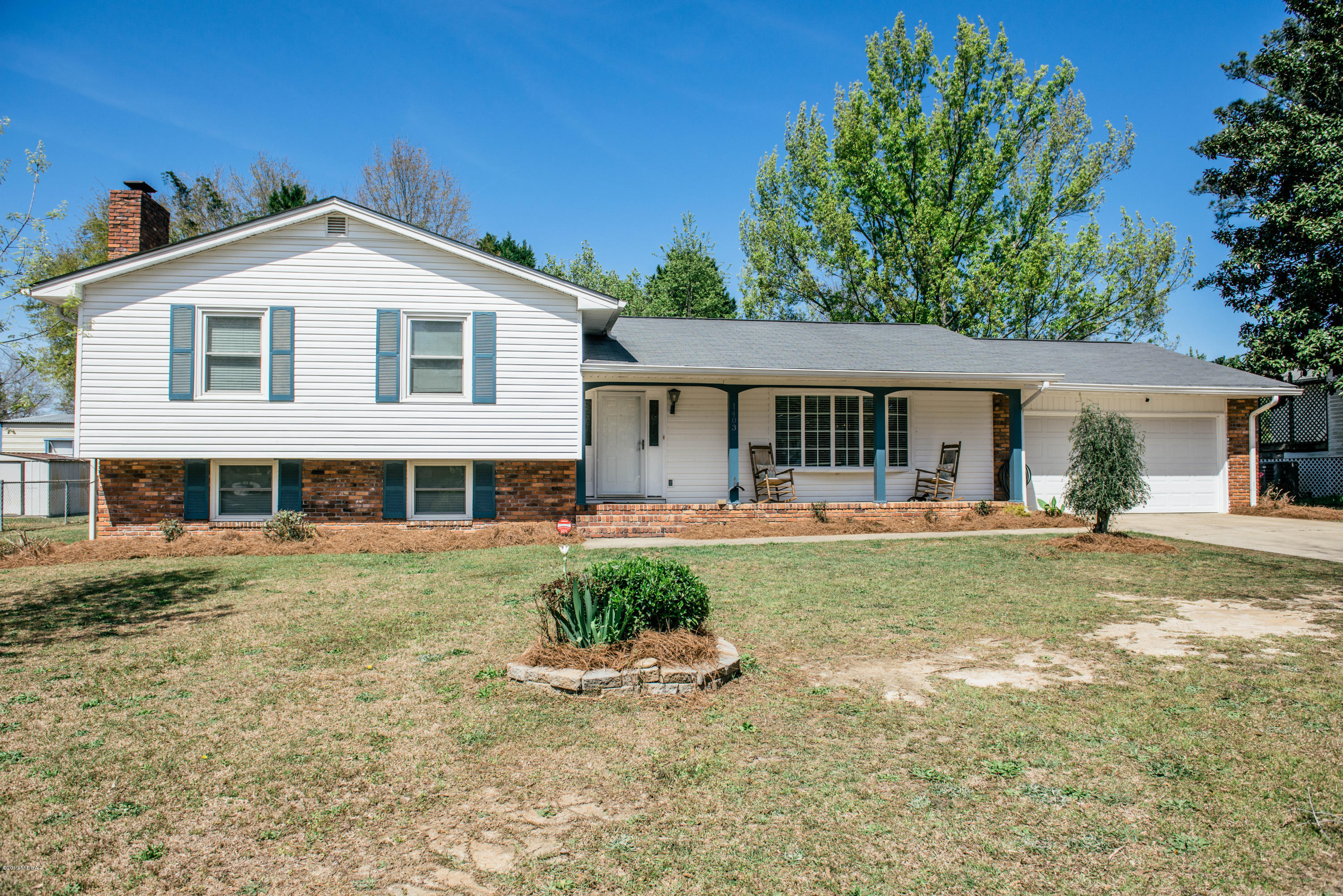 1403 Cambridge Road Perry, GA 31069 - Photo 1 of 38 a view of a yard in front of house