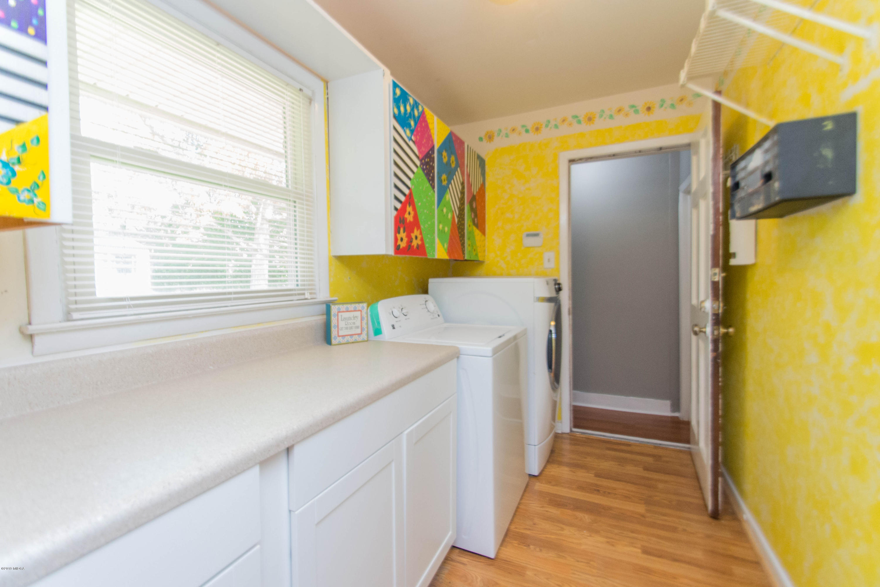 1403 Cambridge Road Perry, GA 31069 - Photo 13 of 38 a kitchen with a sink a refrigerator and a window