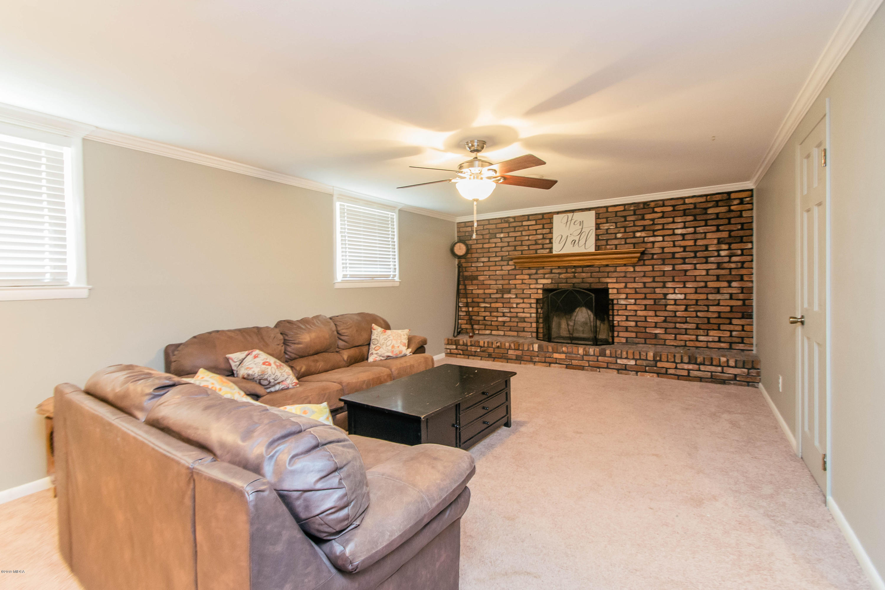 1403 Cambridge Road Perry, GA 31069 - Photo 14 of 38 a living room with furniture and a fireplace