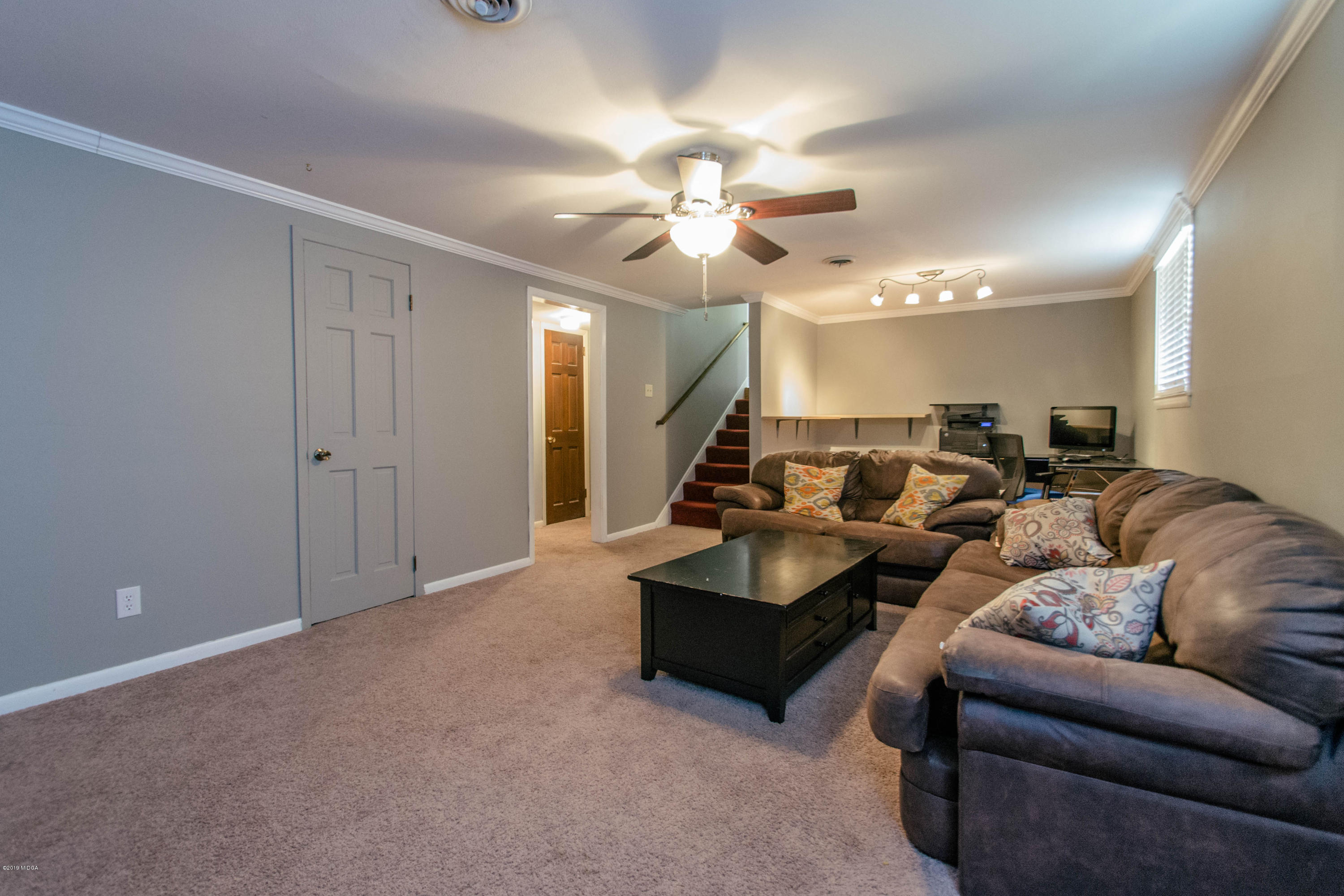 1403 Cambridge Road Perry, GA 31069 - Photo 16 of 38 a living room with couches and kitchen view