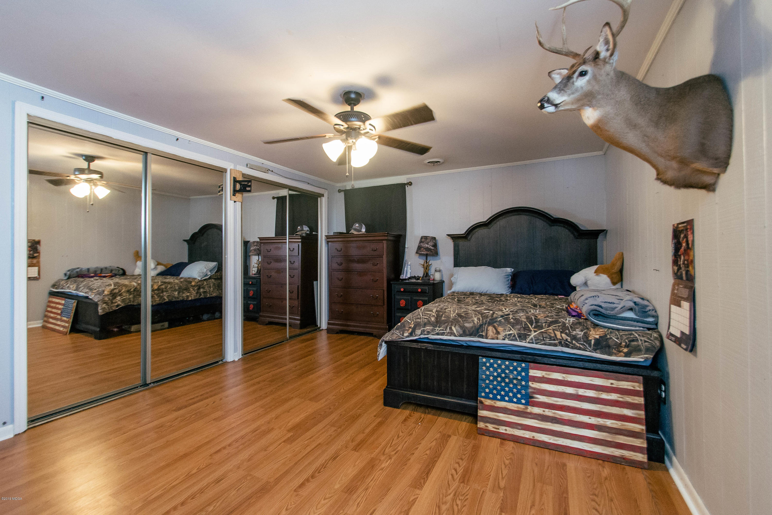 1403 Cambridge Road Perry, GA 31069 - Photo 20 of 38 a living room with furniture and wooden floor