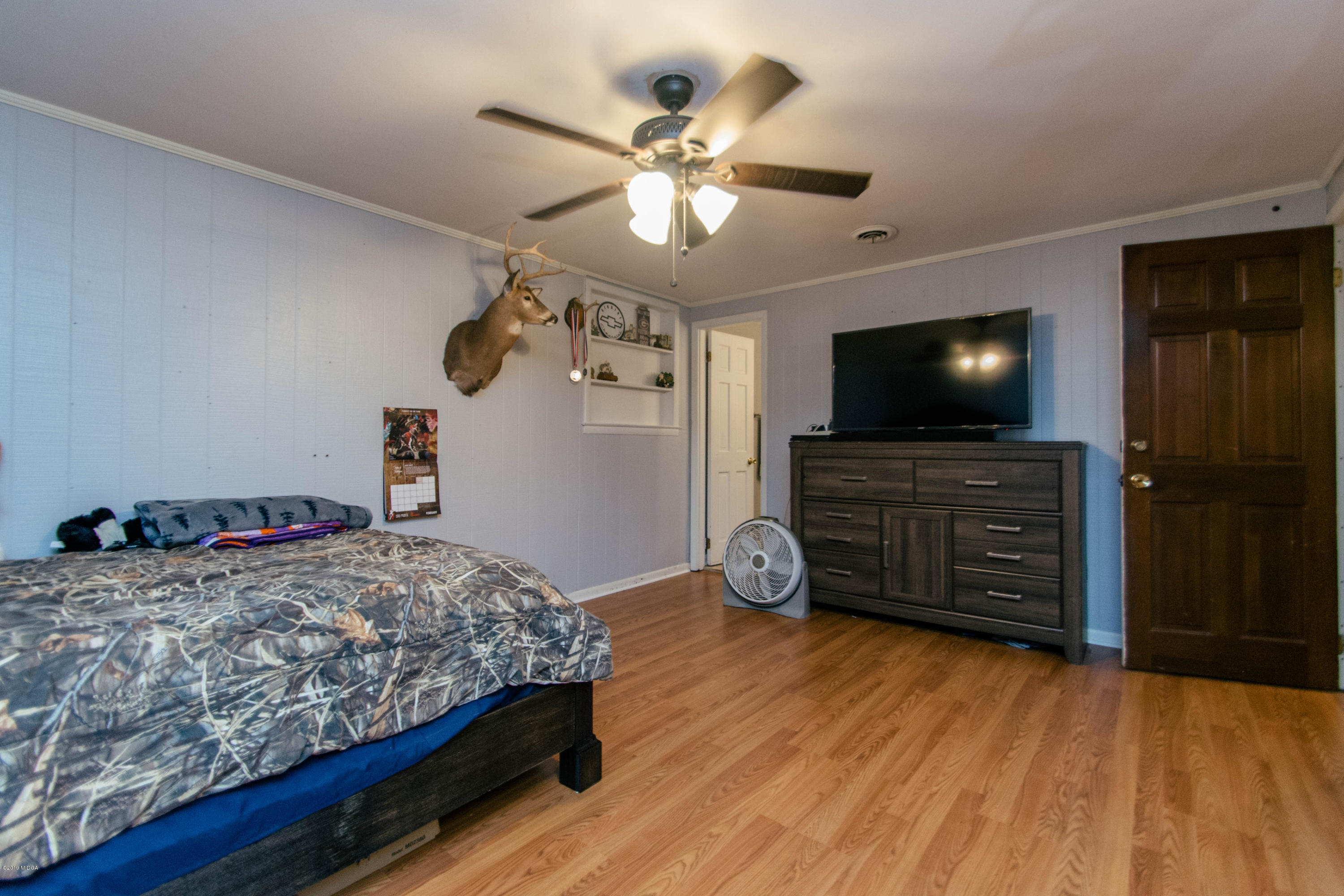 1403 Cambridge Road Perry, GA 31069 - Photo 22 of 38 a bedroom with a bed and a flat screen tv