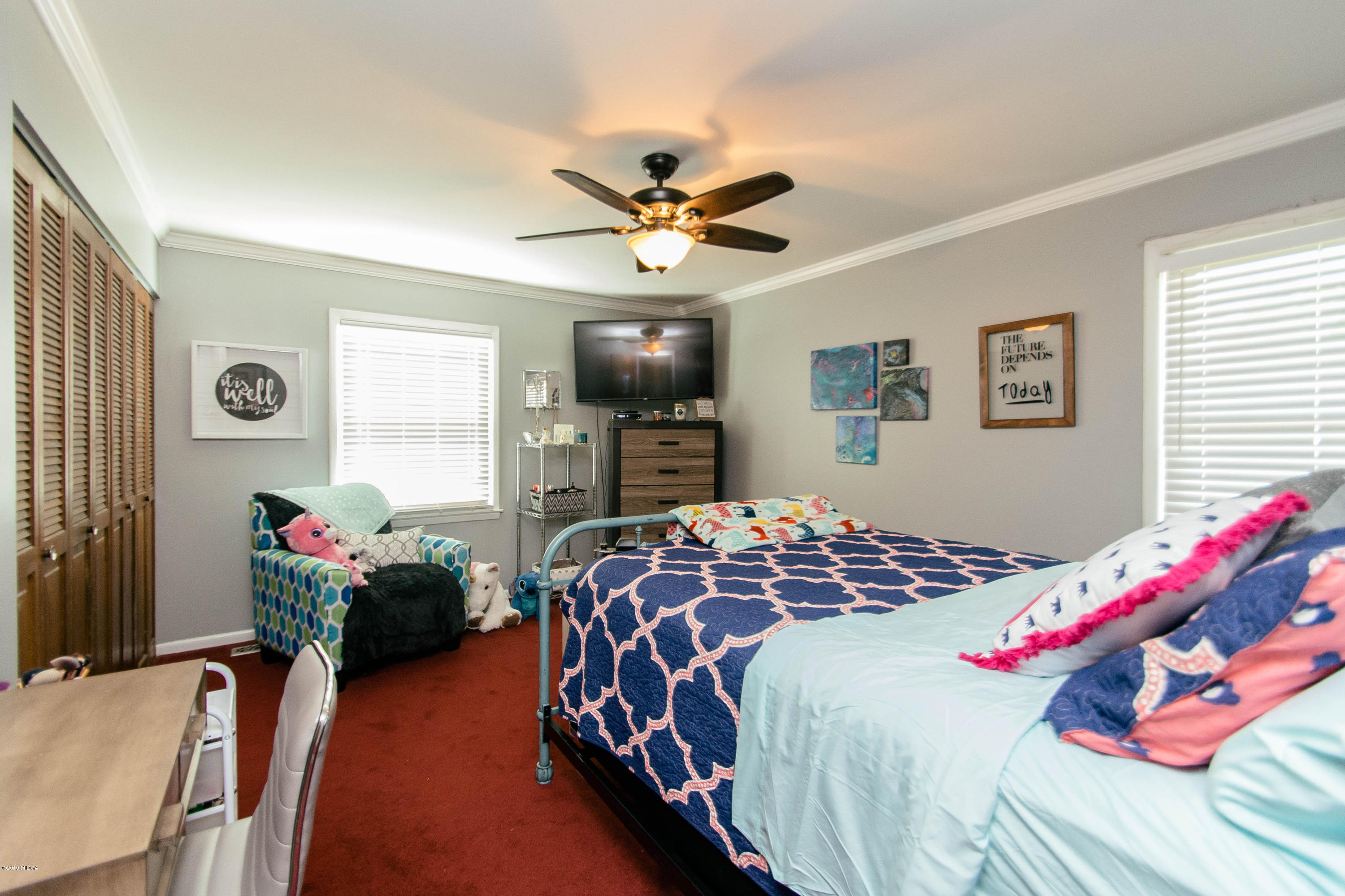 1403 Cambridge Road Perry, GA 31069 - Photo 23 of 38 a bedroom with a bed and furniture