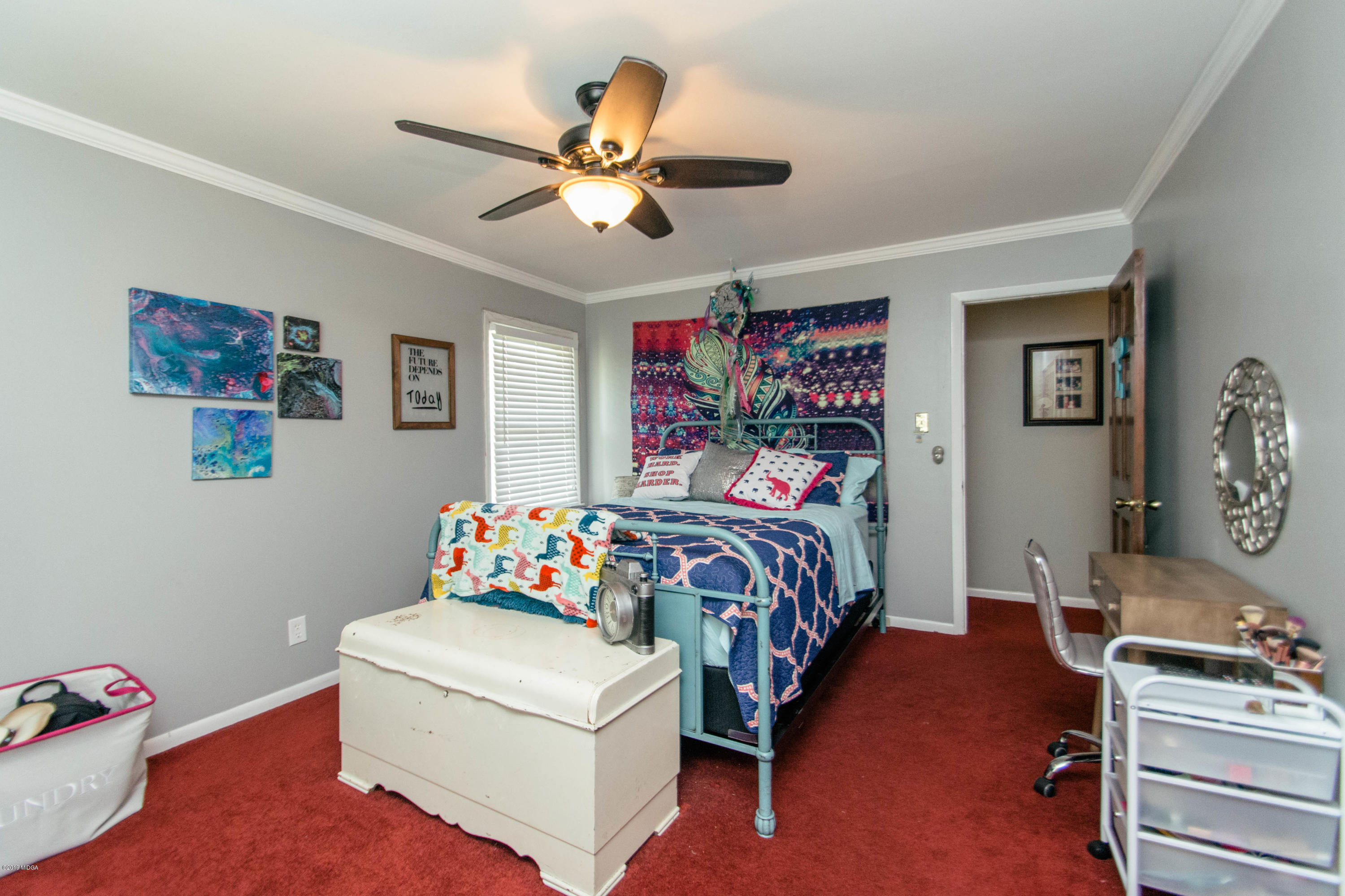 1403 Cambridge Road Perry, GA 31069 - Photo 24 of 38 a bedroom with a bed and furniture