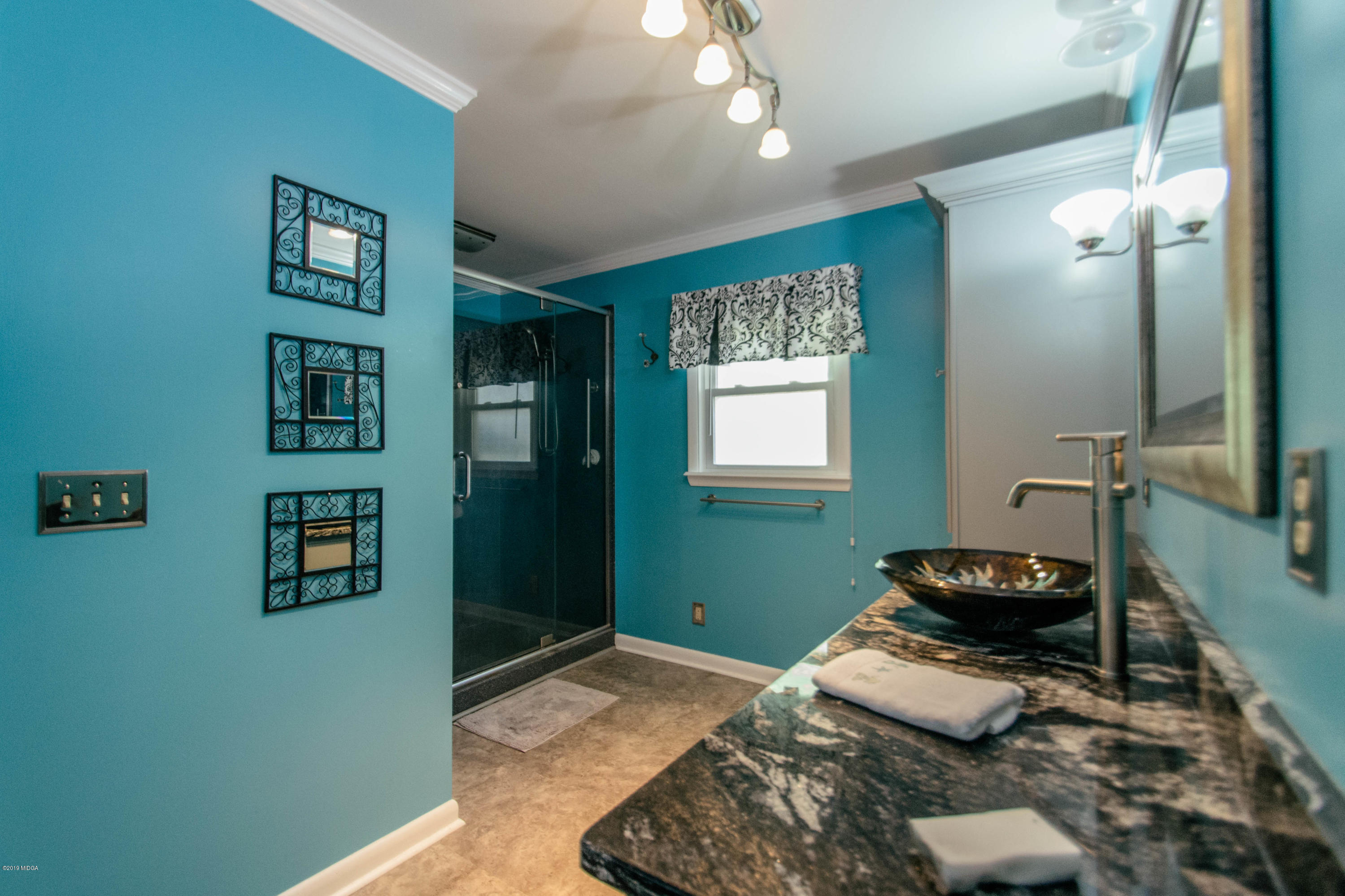 1403 Cambridge Road Perry, GA 31069 - Photo 27 of 38 a bedroom with bed and a window