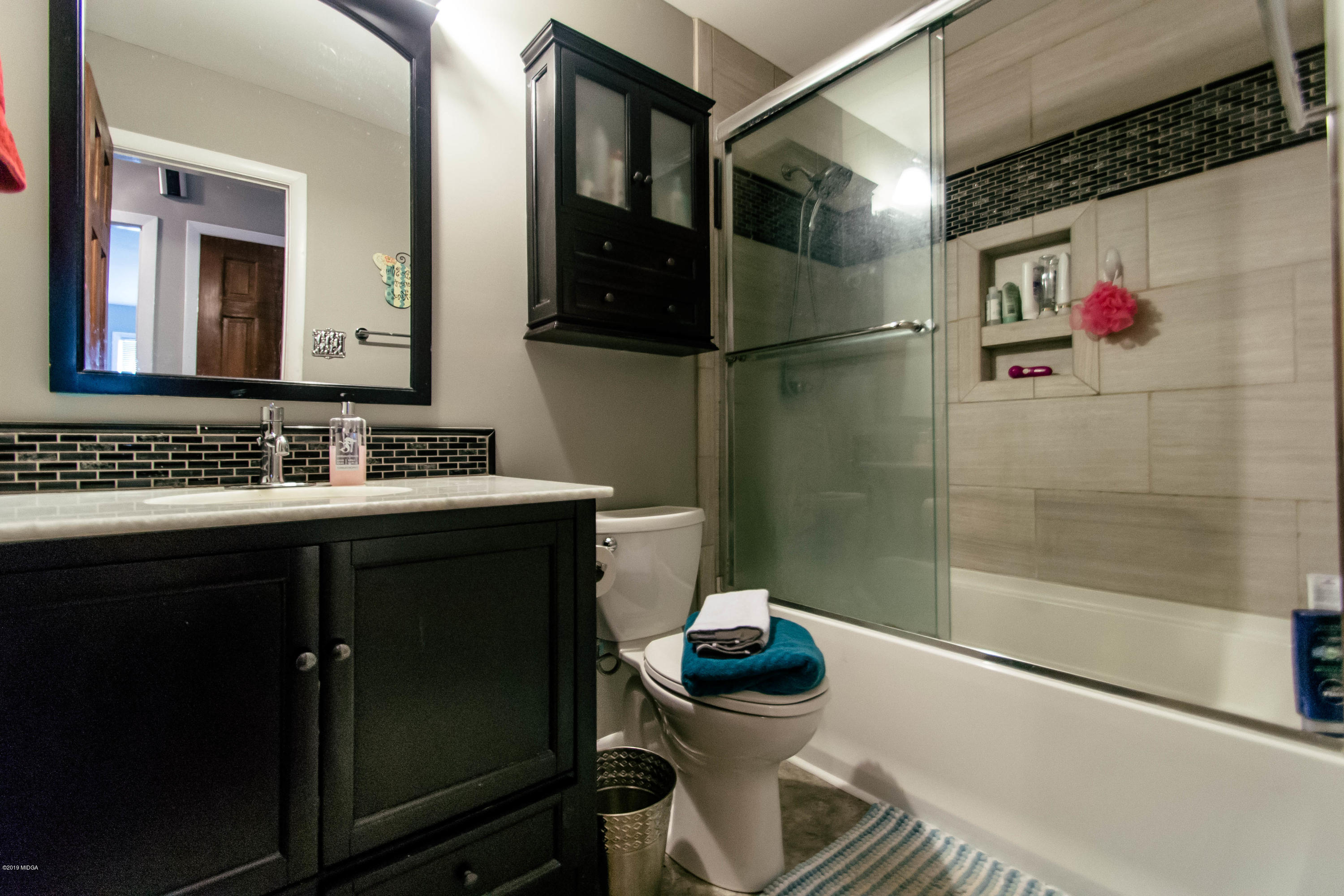1403 Cambridge Road Perry, GA 31069 - Photo 31 of 38 a bathroom with a sink and a mirror