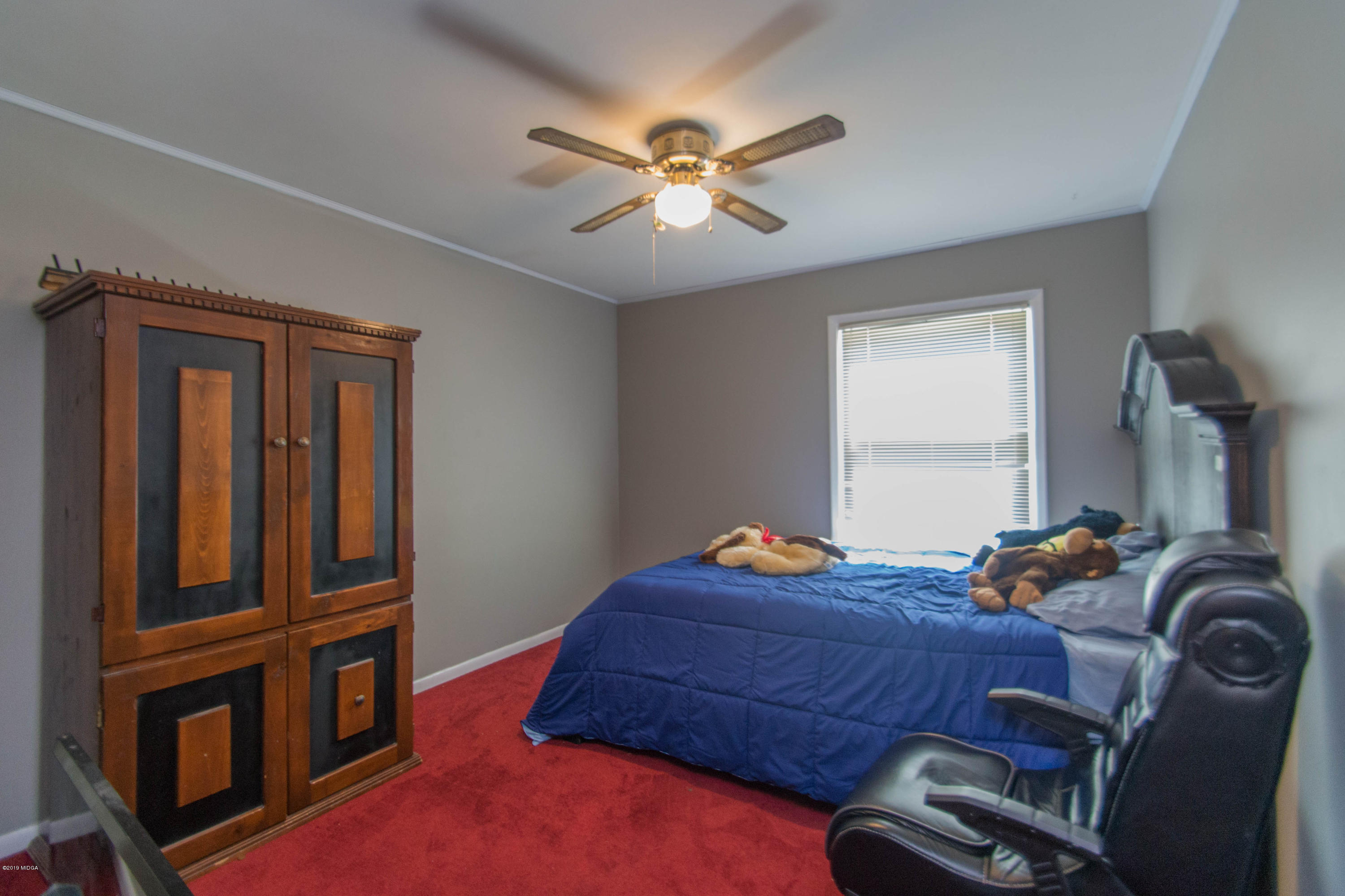 1403 Cambridge Road Perry, GA 31069 - Photo 32 of 38 a bed room with a bed and a window
