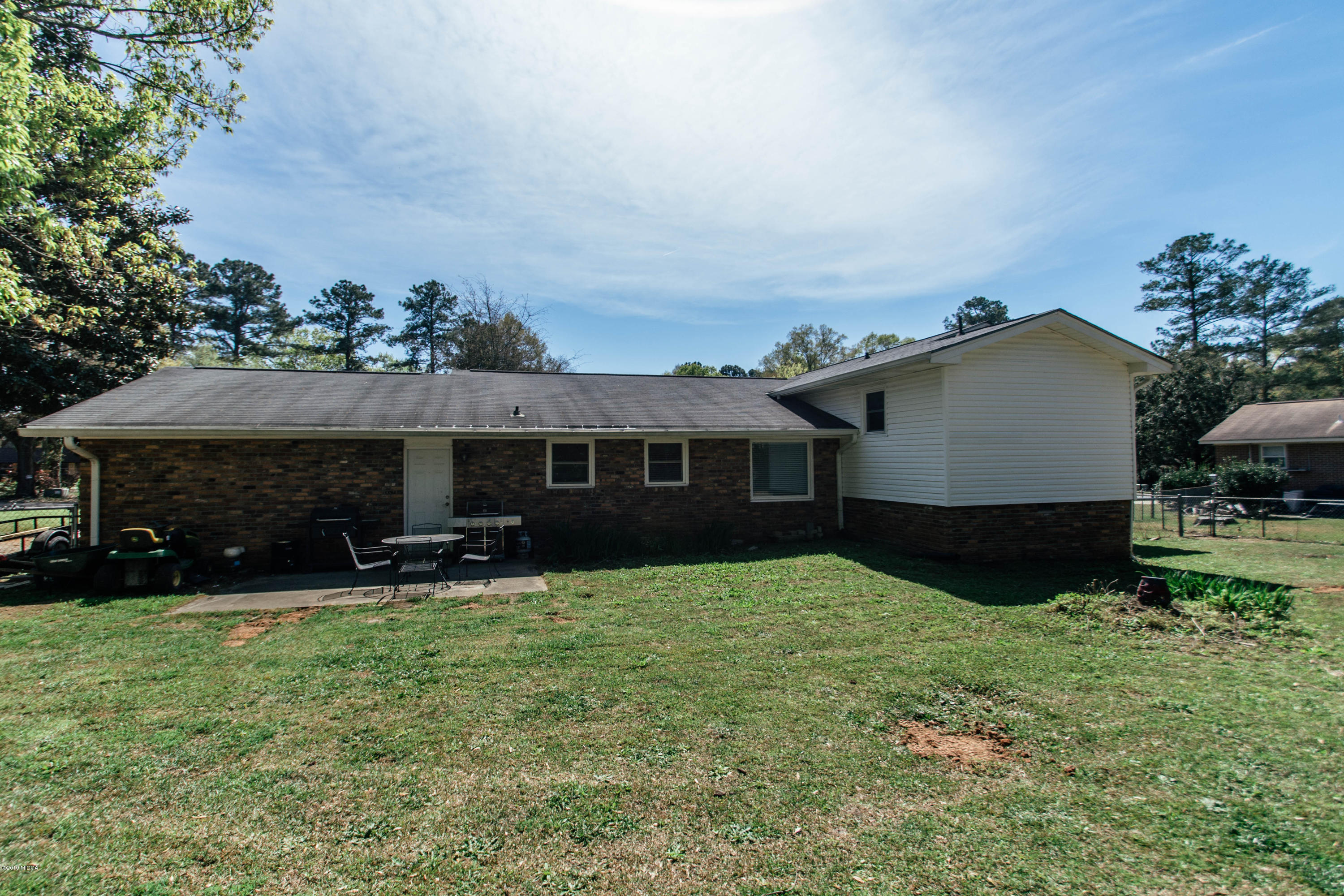 1403 Cambridge Road Perry, GA 31069 - Photo 36 of 38 a view of house with yard and sitting area
