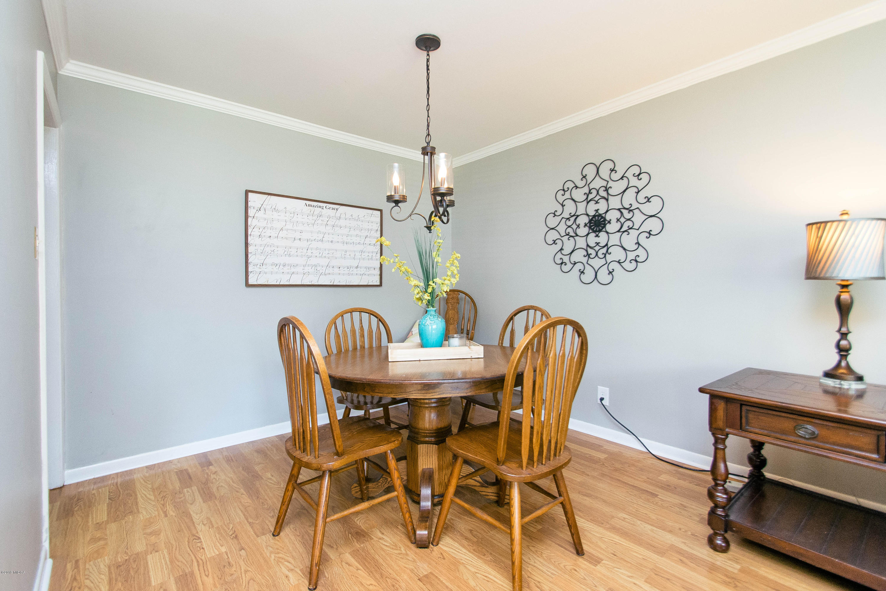 1403 Cambridge Road Perry, GA 31069 - Photo 5 of 38 a view of a dining room with furniture and chandelier