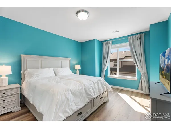 a bedroom with a bed and a view of bedroom