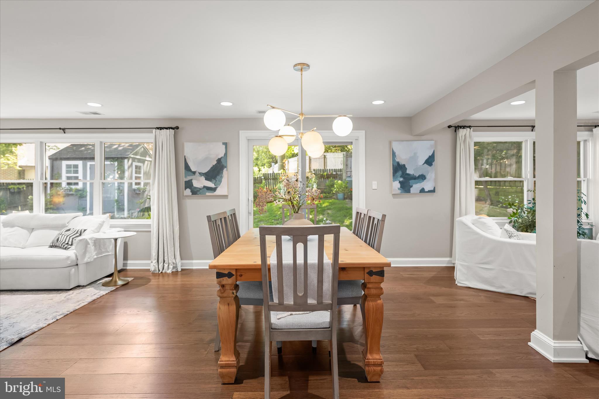 6366 11th Road North Arlington, VA 22205 - Photo 11 of 39 a view of a dining room with furniture window and wooden floor