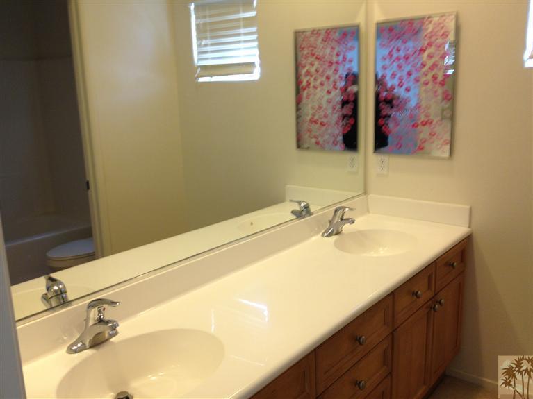 83449 Stagecoach Road Indio, CA 92203 - Photo 14 of 16 a bathroom with a sink and a mirror