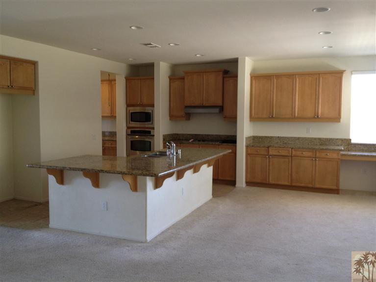 83449 Stagecoach Road Indio, CA 92203 - Photo 3 of 16 a kitchen with stainless steel appliances a sink and a refrigerator