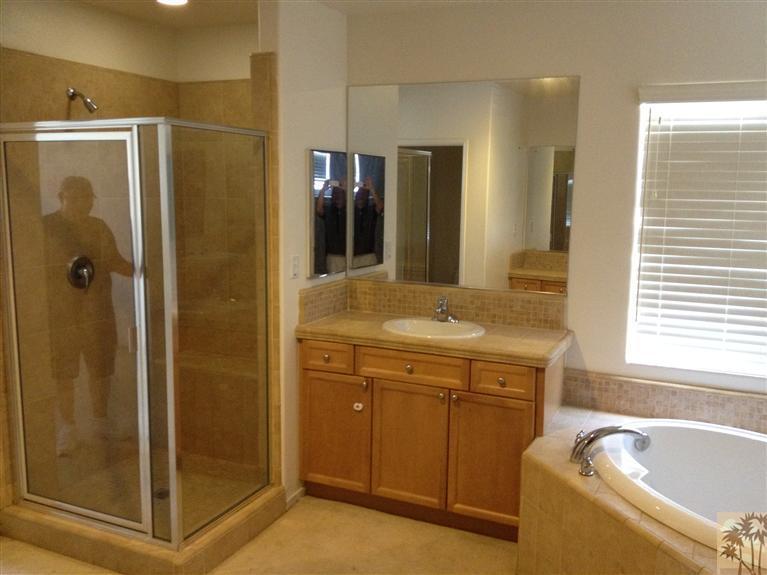 83449 Stagecoach Road Indio, CA 92203 - Photo 4 of 16 a bathroom with a tub sink shower and mirror