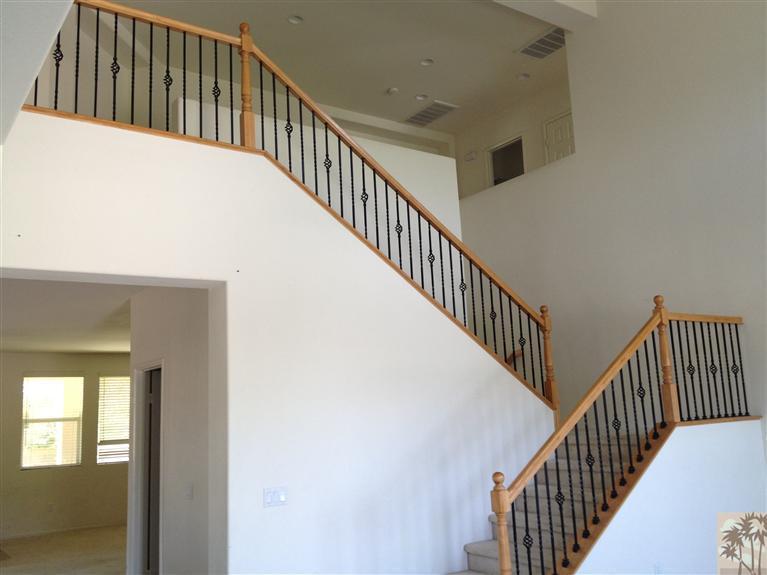 83449 Stagecoach Road Indio, CA 92203 - Photo 7 of 16 a view of staircase with railing and white walls