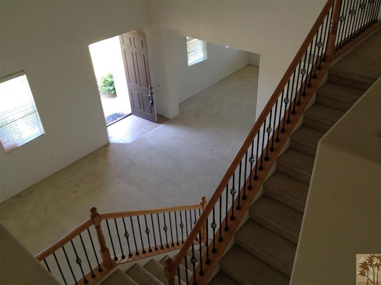 83449 Stagecoach Road Indio, CA 92203 - Photo 9 of 16 a view of staircase with wooden floor and fan