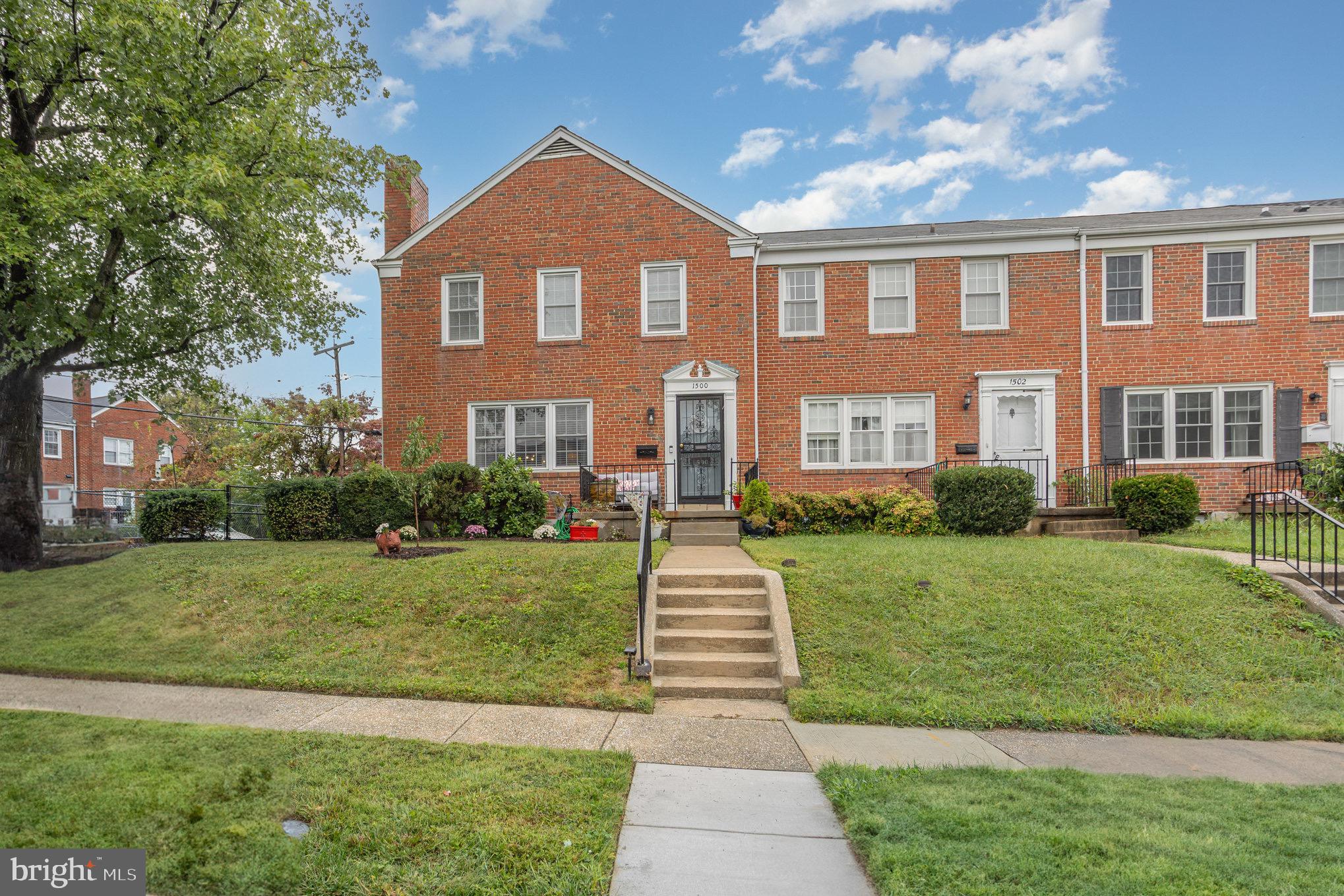 1500 Doxbury Road Baltimore, MD 21286 - Photo 1 of 36 a front view of a house with a yard and trees