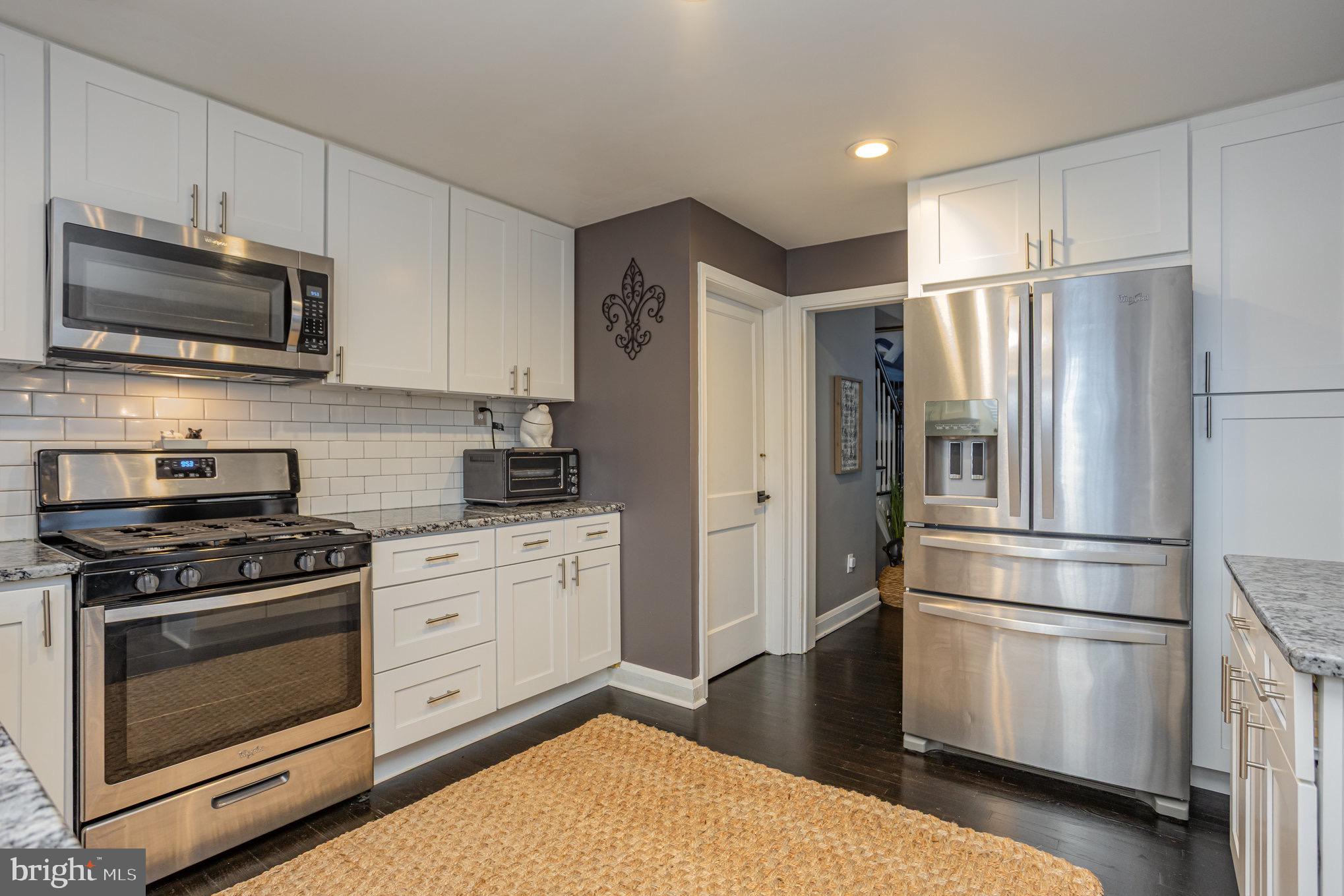 1500 Doxbury Road Baltimore, MD 21286 - Photo 11 of 36 a kitchen with stainless steel appliances a refrigerator stove and microwave