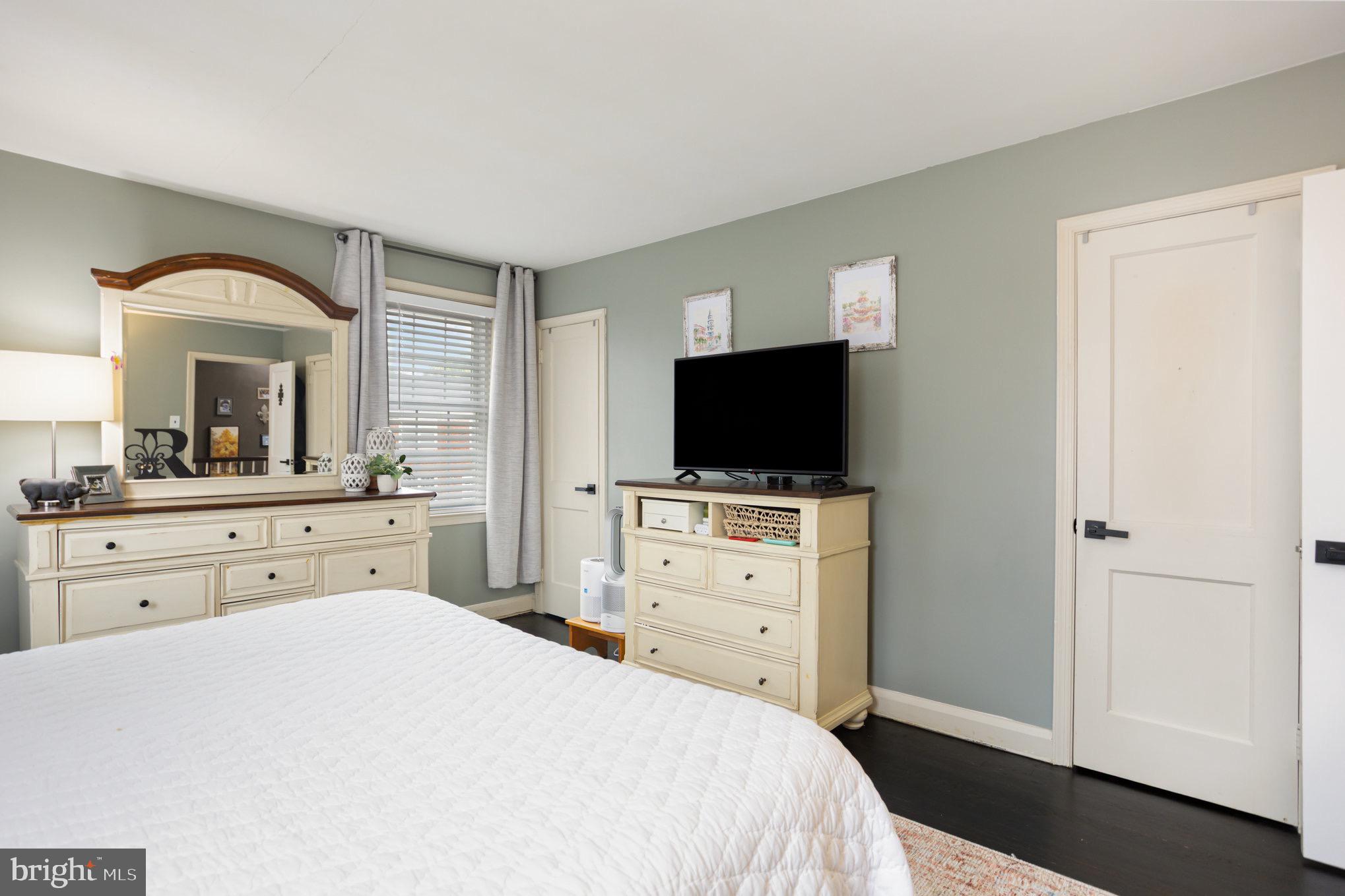 1500 Doxbury Road Baltimore, MD 21286 - Photo 21 of 36 a bedroom with a bed and a flat screen tv in it