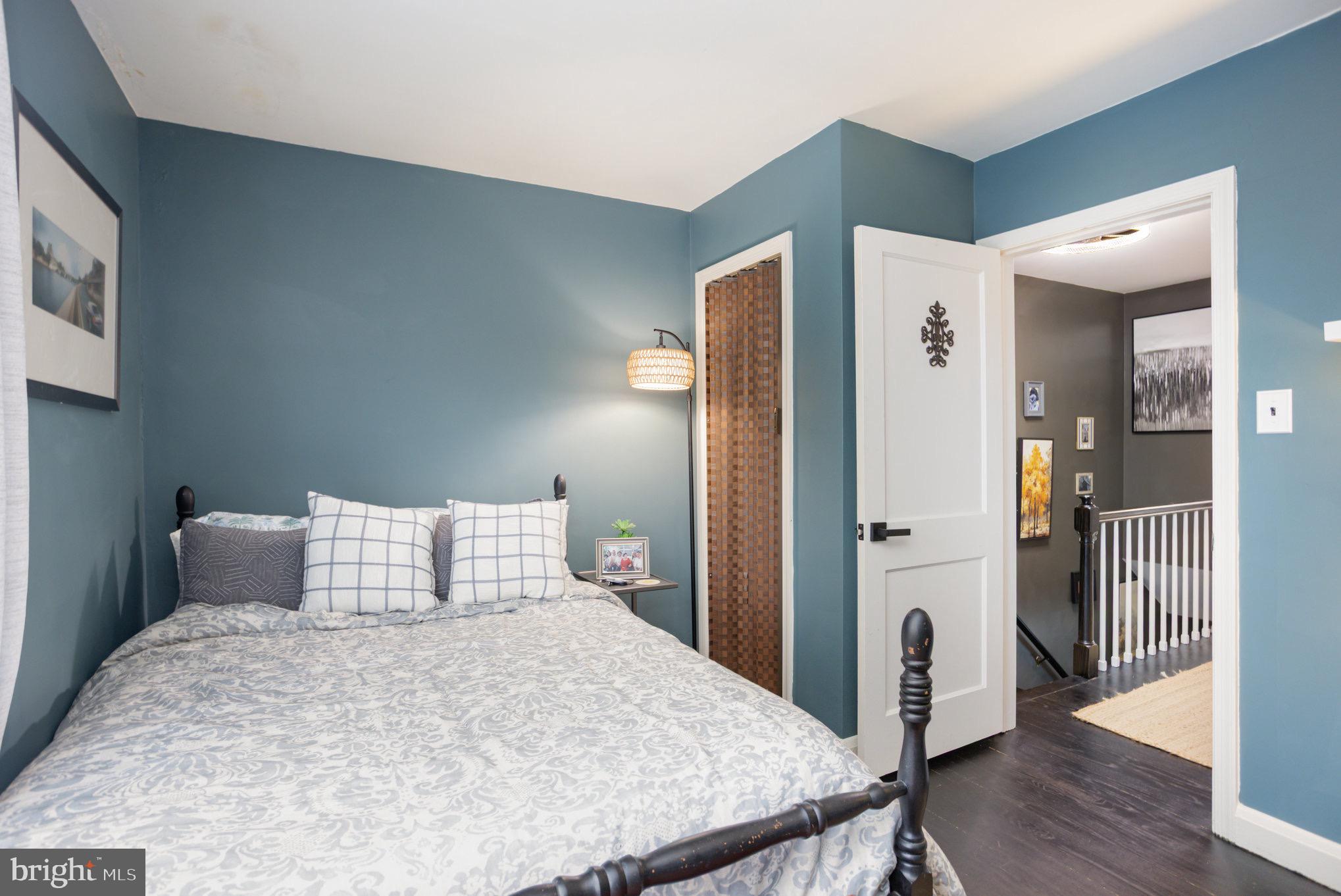 1500 Doxbury Road Baltimore, MD 21286 - Photo 26 of 36 a bedroom with a bed and wooden floor