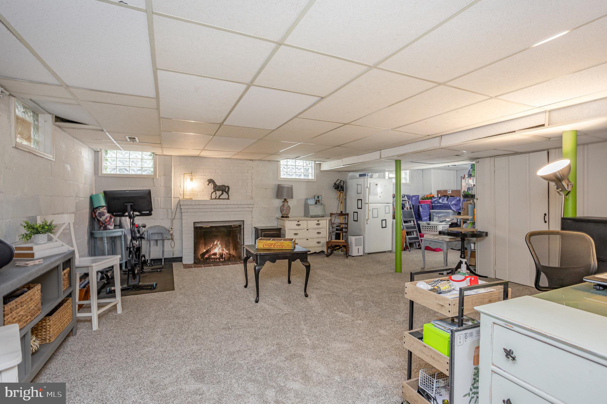 1500 Doxbury Road Baltimore, MD 21286 - Photo 29 of 36 a living room with furniture and a fireplace