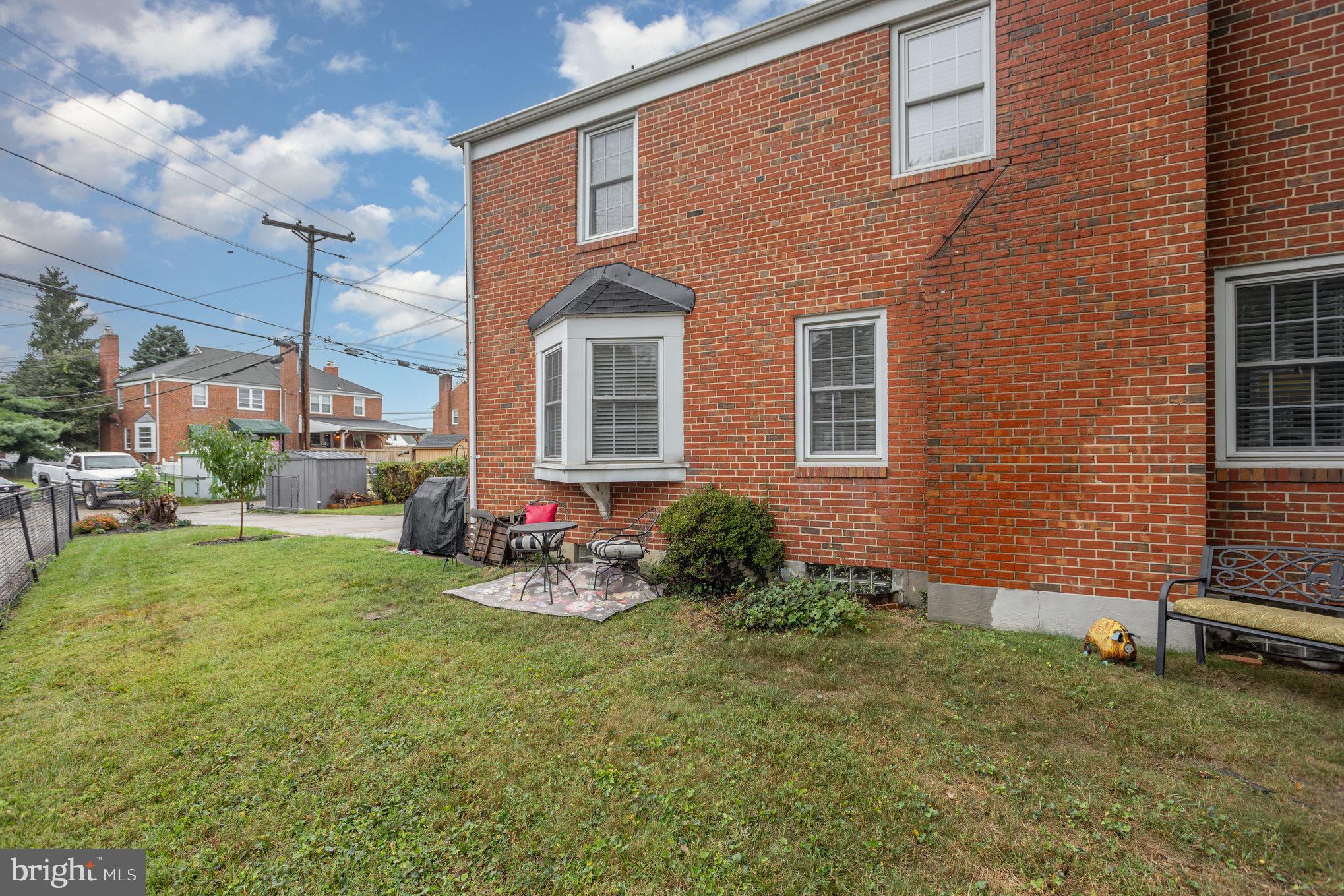 1500 Doxbury Road Baltimore, MD 21286 - Photo 33 of 36 a view of a backyard with plants and brick wall